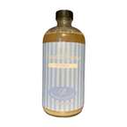 Bottle of Castile Soap with a striped label on a white background