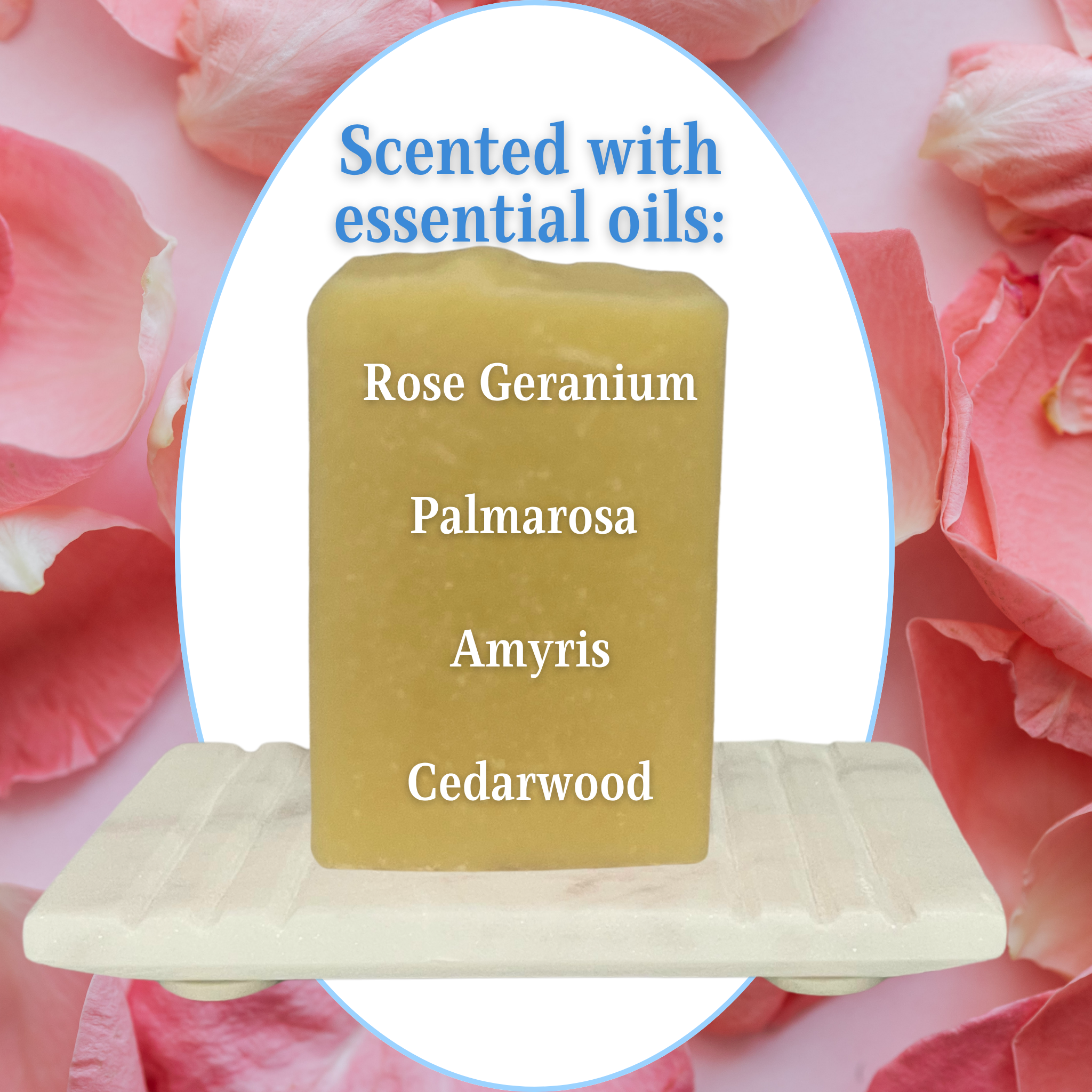 Bar of soap on a stand with scented ingredients listed, surrounded by pink flowers.