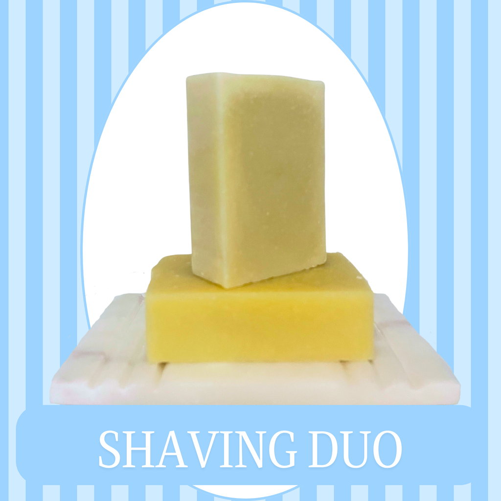 Blue Striped Background with White Oval Frame of a set of soaps sitting on a  soap dish. One is a white unscented bar soap, the other is a White colored Shaving Bar. The text reads Shaving Duo.